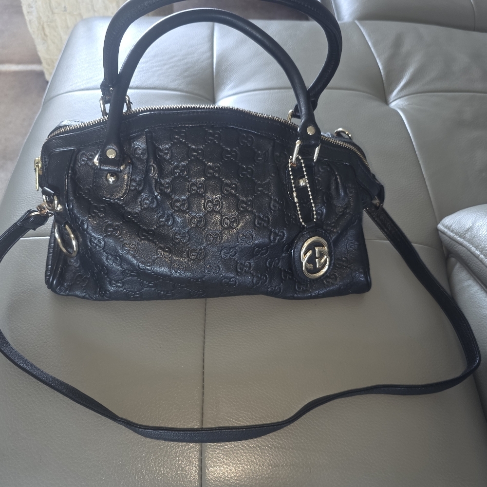 GUCCI Authentic  Black Guccissima Embossed Leather Satchel With Strap and Charm.